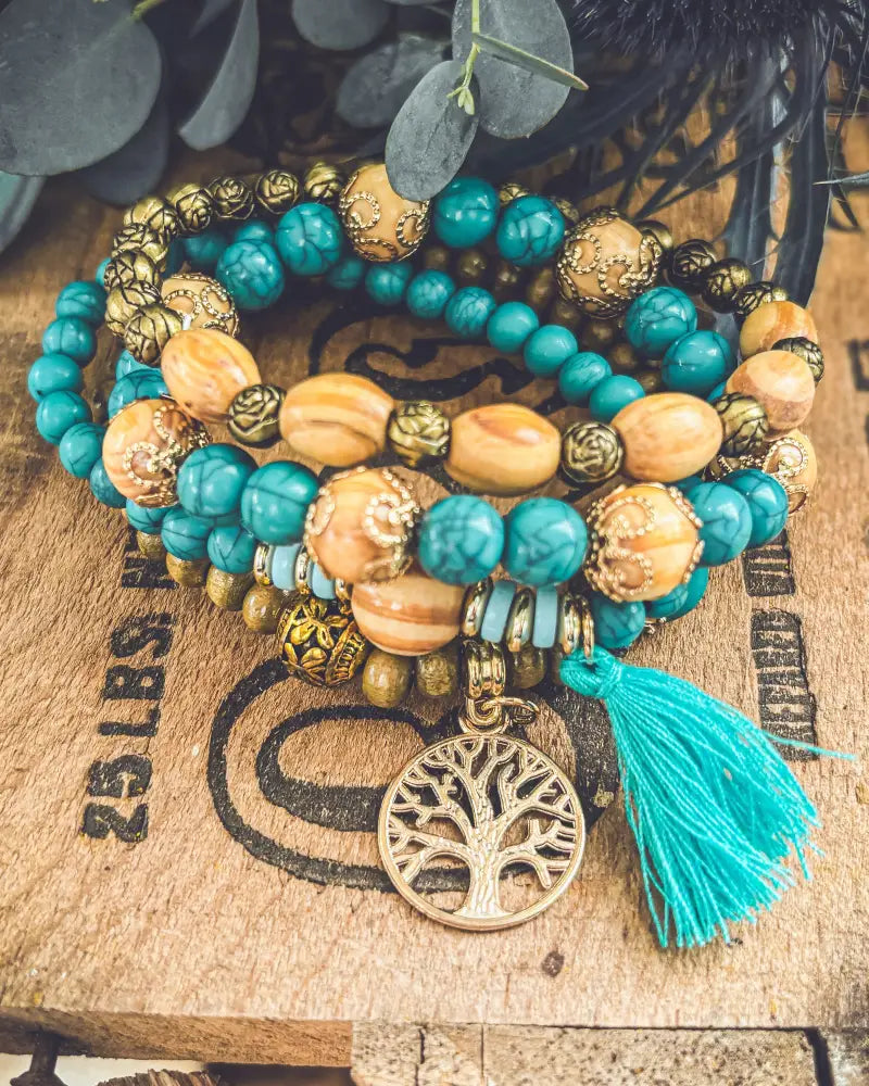 Turquoise tree of life and wood beaded bracelet set with amber beads gold-toned accents and matching tassel charm