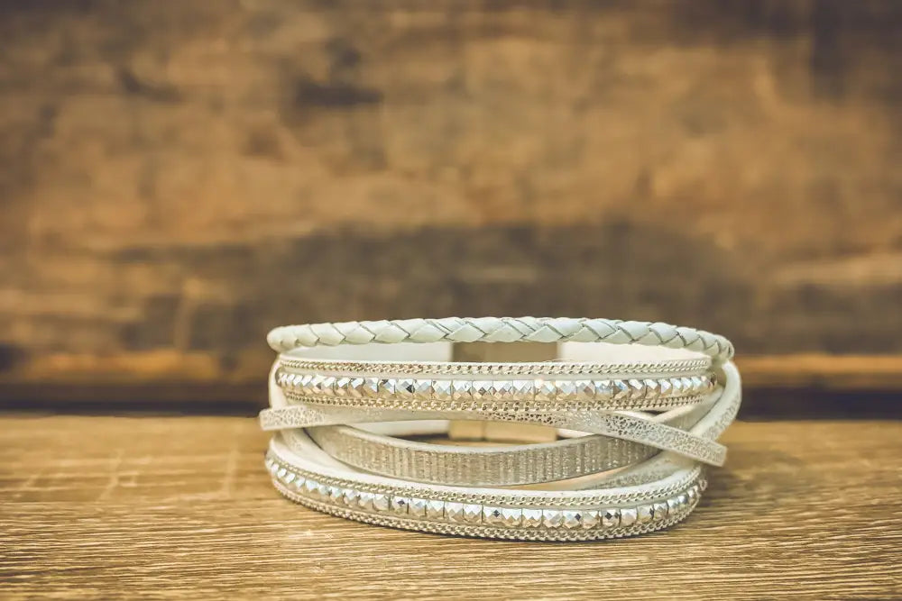 White layered leather wrap bracelet with silver-toned beaded and braided detailing in white leather