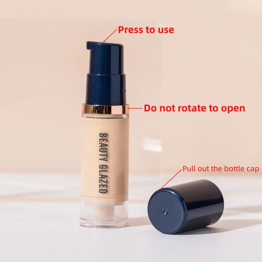 Beauty glazed makeup set liquid foundation in a sleek transparent bottle with navy blue and gold accents and puff