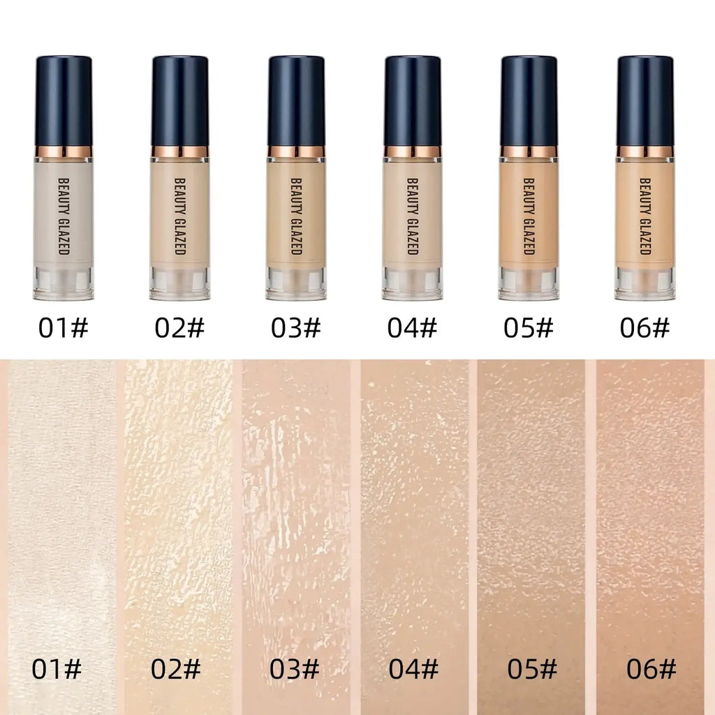 Six beauty glazed makeup set liquid foundation bottles with navy caps and rose gold accents in varying beige tones