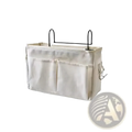 Beige linen bedside storage caddy hanging organizer with black metal hooks and side pockets for fabric overhead use