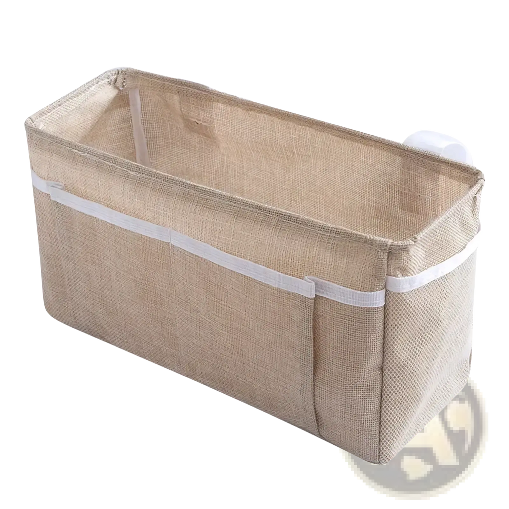 Beige woven fabric bedside storage caddy with white suction cups and elastic band for nursery organization