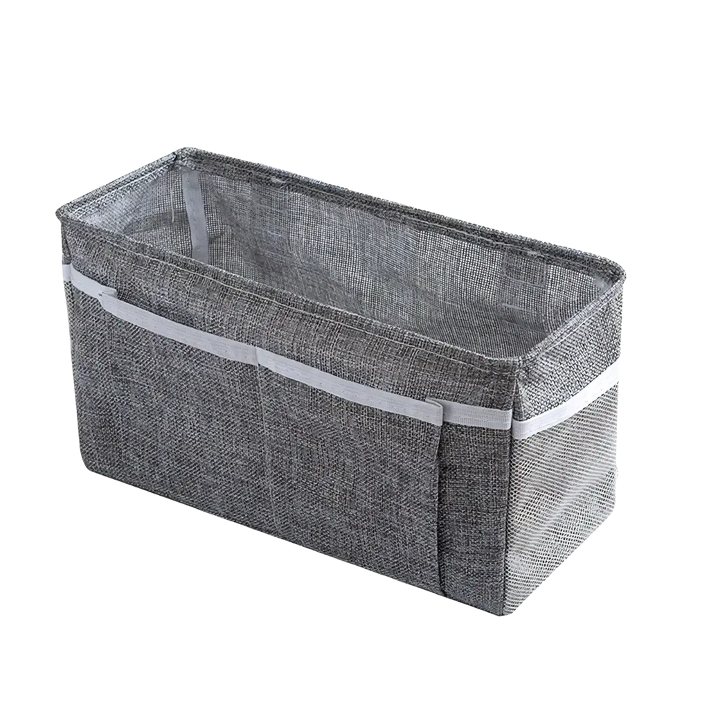 Gray textured fabric bedside storage caddy with white adhesive hooks and gray elastic band for nursery organization