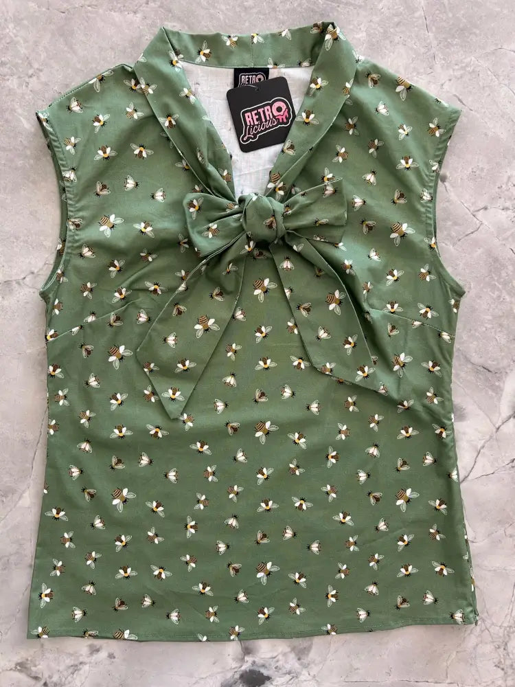 Olive green vintage bee print sleeveless cotton blouse with matching fabric bow at the neckline