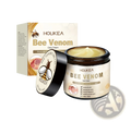 Holkea bee venom skin cream in a brown jar with black lid featuring a bee logo and cream-colored label 50g