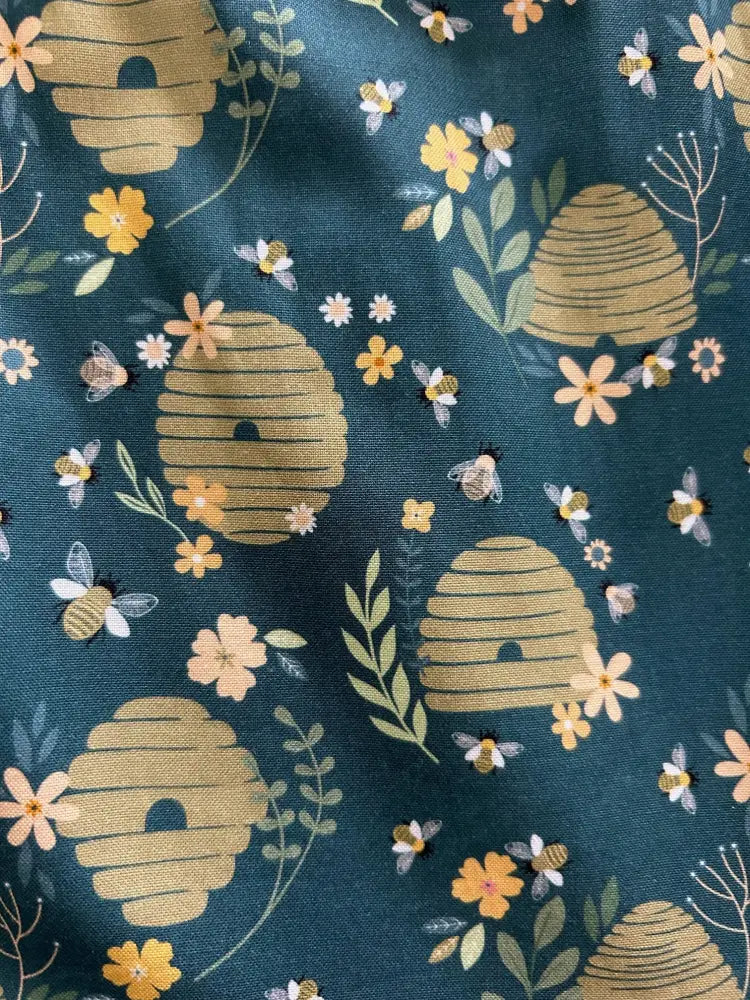Vintage teal beehive floral cotton fit and flare dress featuring golden beehives yellow and peach flowers and bees