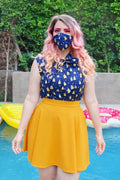 Blue cotton face mask with yellow pear pattern reversible with beehive and celestial nocturnal design