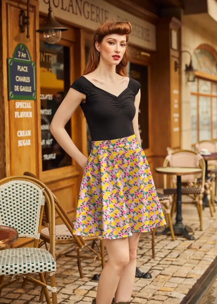 Bees and Dandelions pink floral cotton skater skirt with vibrant yellow flared silhouette and pink green blossoms
