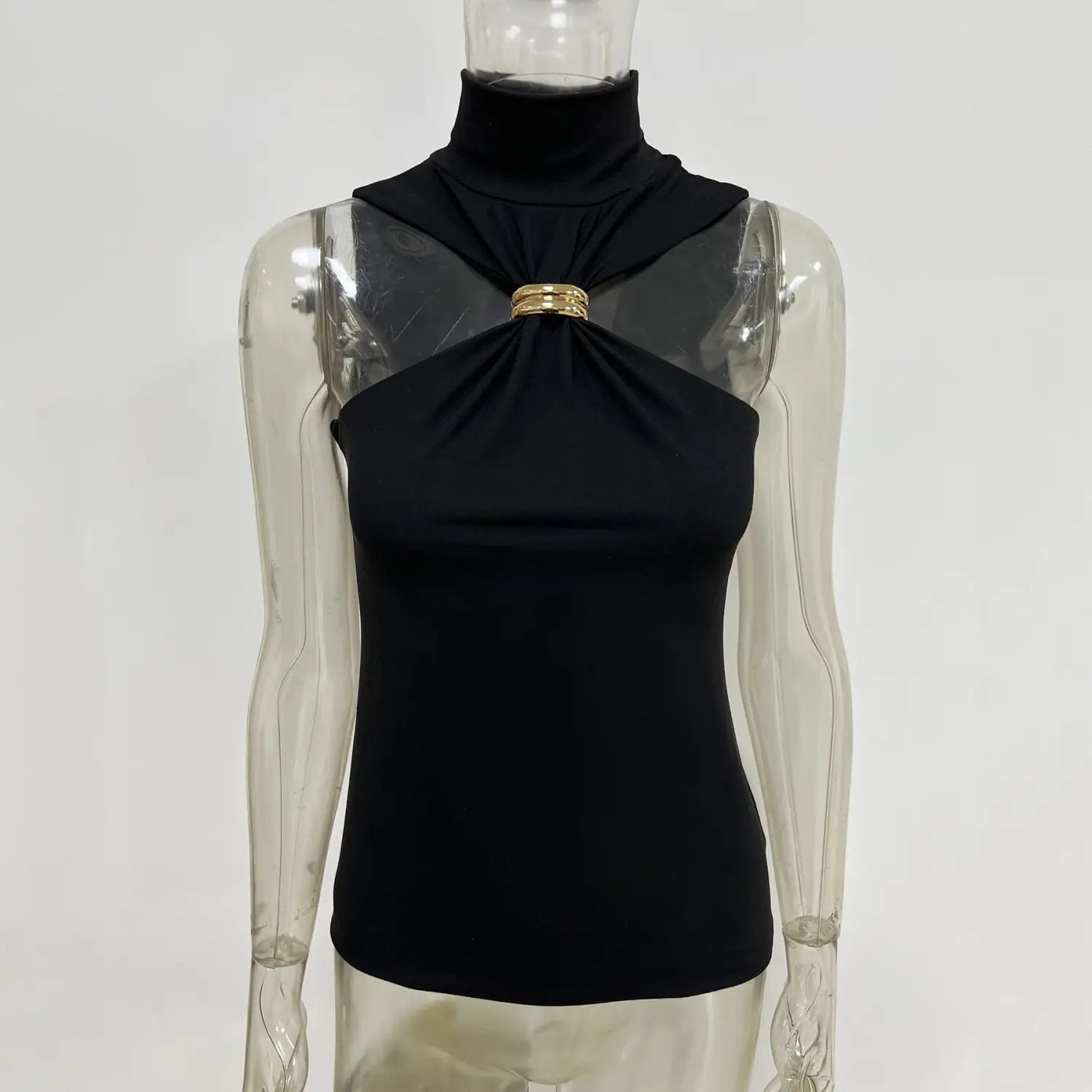 Black halter stretch top with a gold-toned metallic ring clasp at the high neckline.