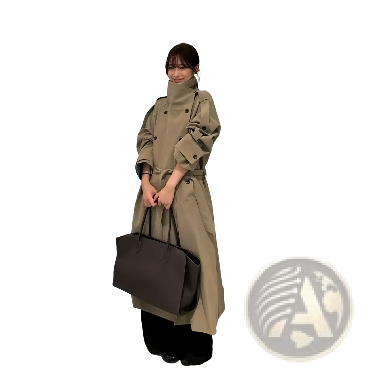 Beige belted trench coat for women with high collar and buttoned cuffs worn over black pants in tan material