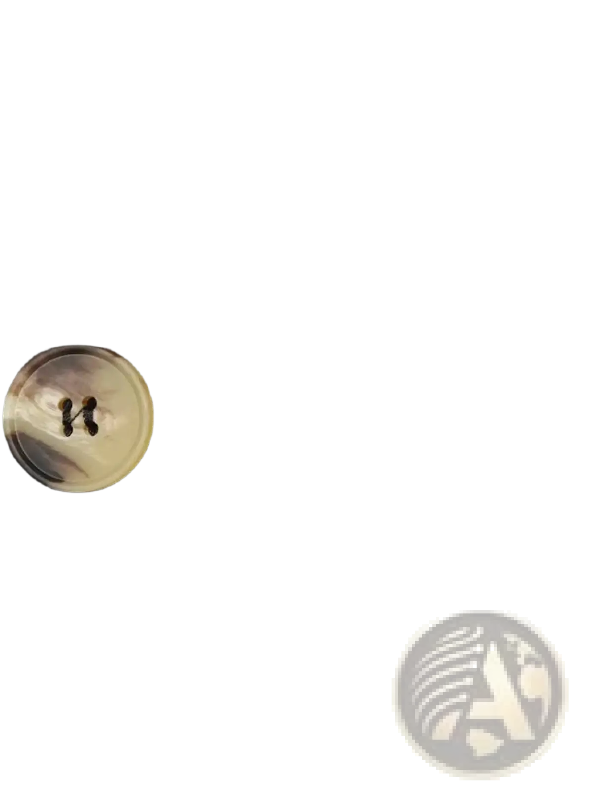 A round translucent button with a swirling beige and brown pattern on a beige double breasted belted trench coat