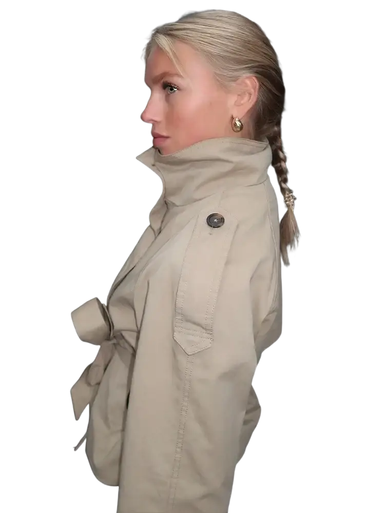Beige double breasted trench coat with high collar button closure and belted waist for stylish outerwear
