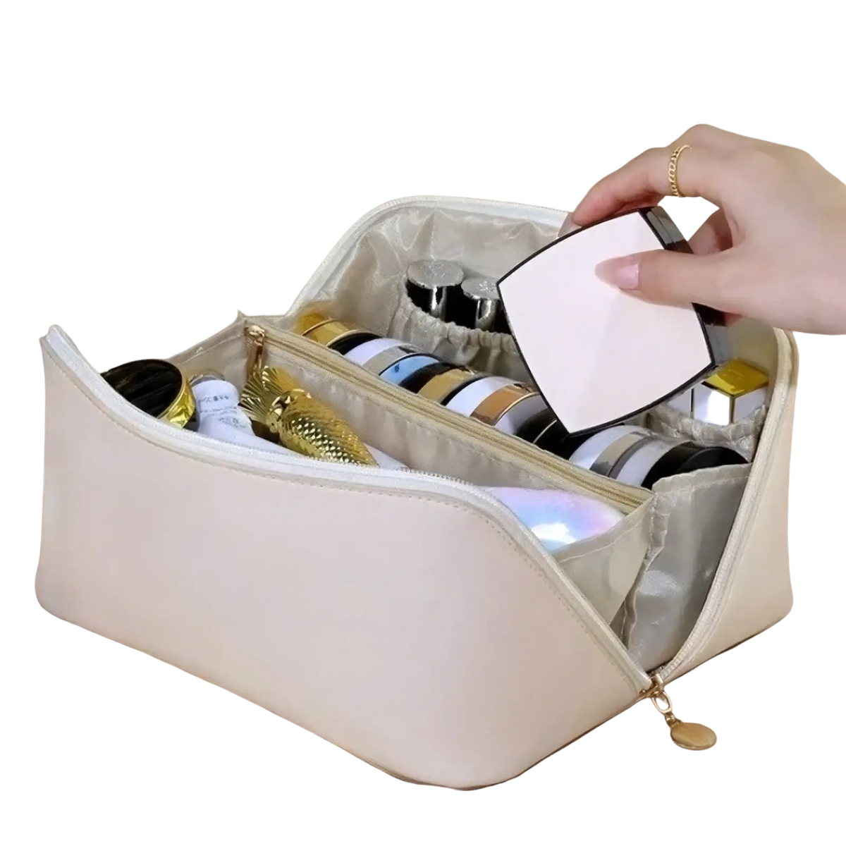 Beige fabric travel makeup bag with gold zipper and interior compartments holding various cosmetics for toiletry organization