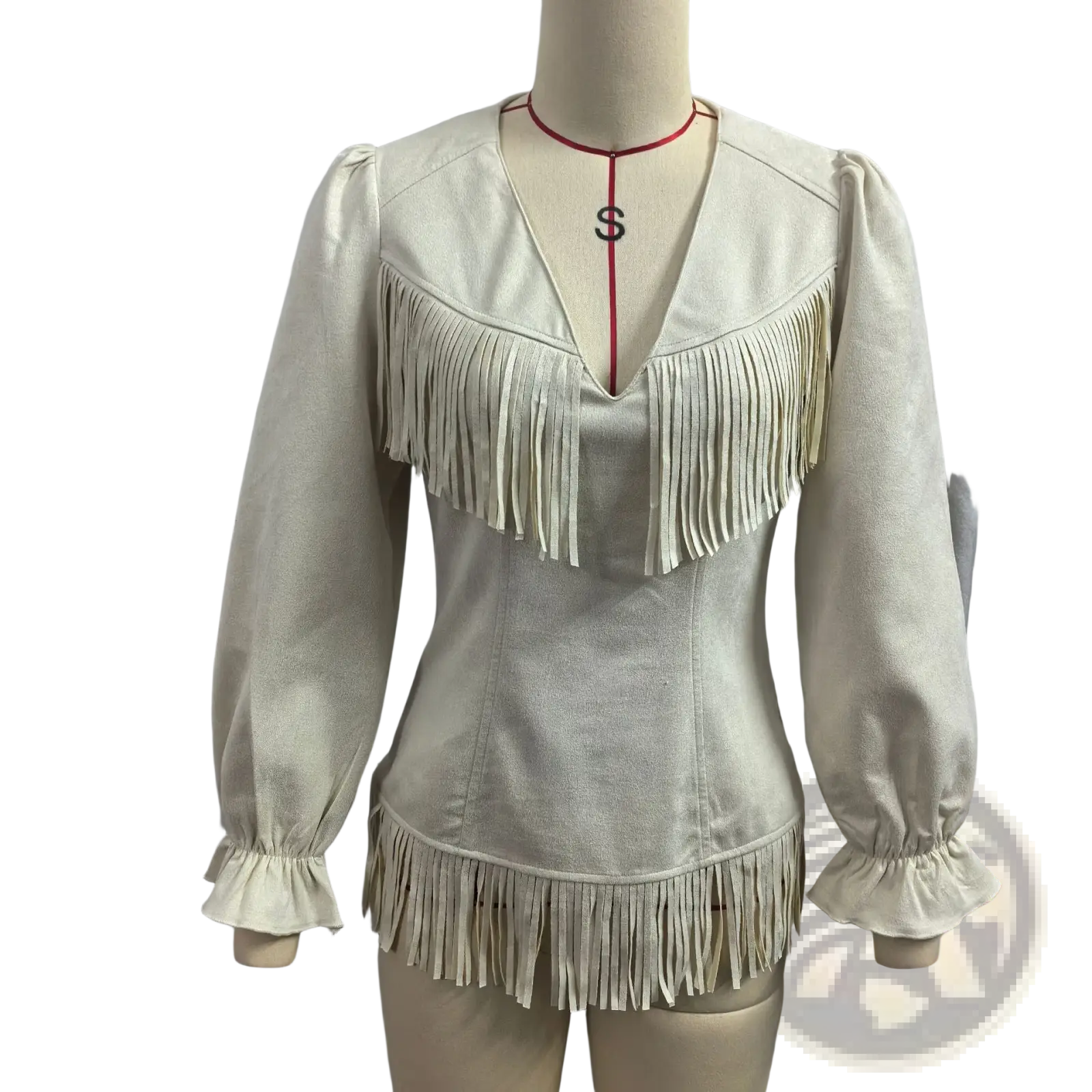Beige fringe suede v-neck jacket with cream-colored suede, long puffed sleeves, and fringe detailing on neckline and hem
