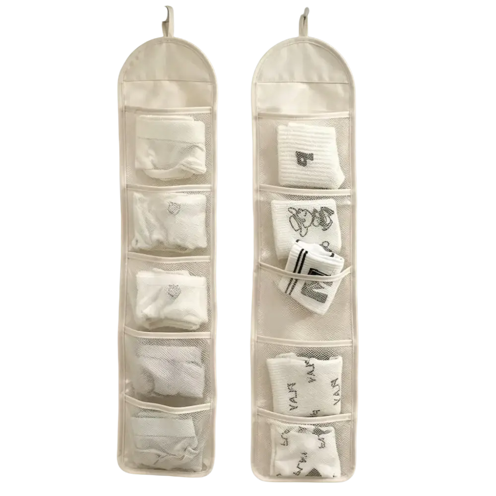 Beige mesh hanging sock organizer with five compartments holding neatly folded white socks for closet storage