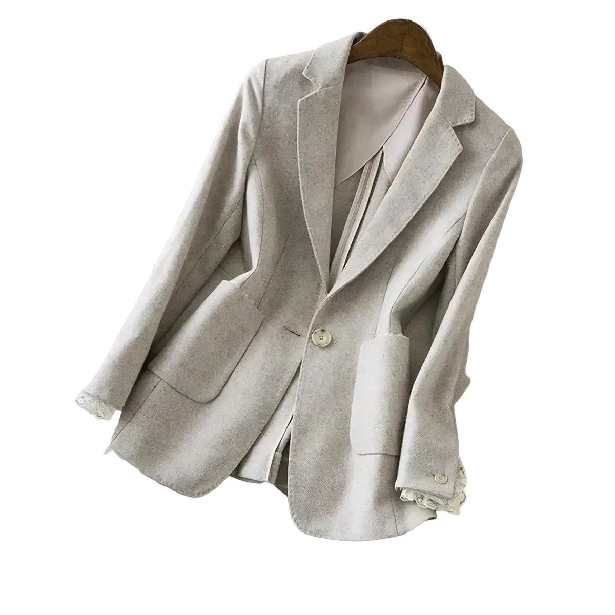 Beige wool blazer with delicate lace trim at cuffs and pocket edges hanging on a wooden hanger
