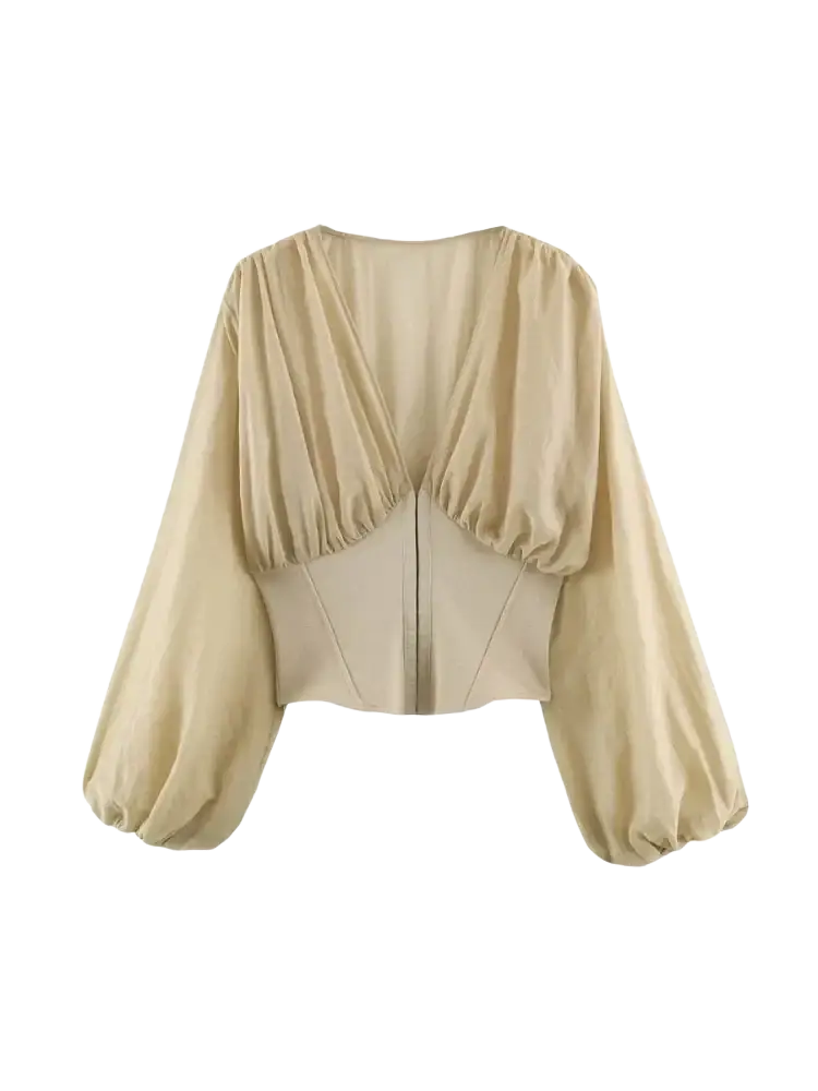 Beige cropped blouse with puffed sleeves and a structured corset-style back shown from the back side