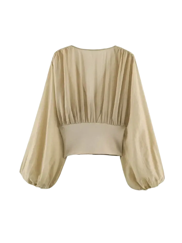 Beige puffed sleeve cropped corset top with long puffed sleeves and a gathered waistband in soft fabric