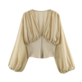 Beige satin blouse with puffed long sleeves and corset-style back shown from the back side