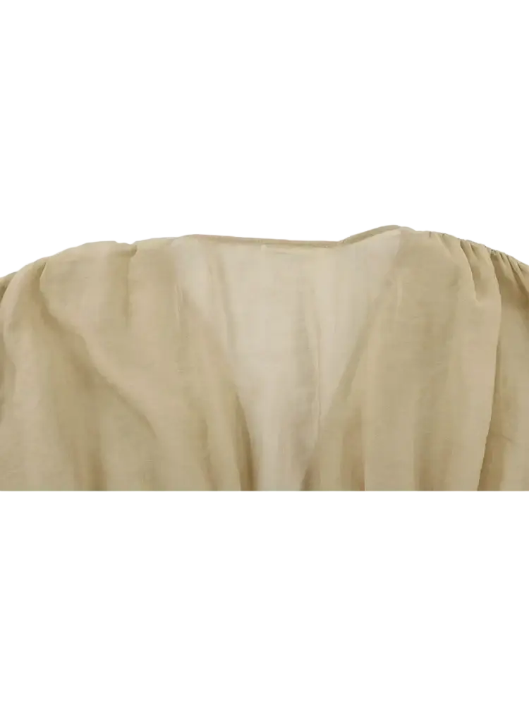 Beige puffed sleeve cropped corset top with softly gathered fabric, gentle drape, and subtle texture