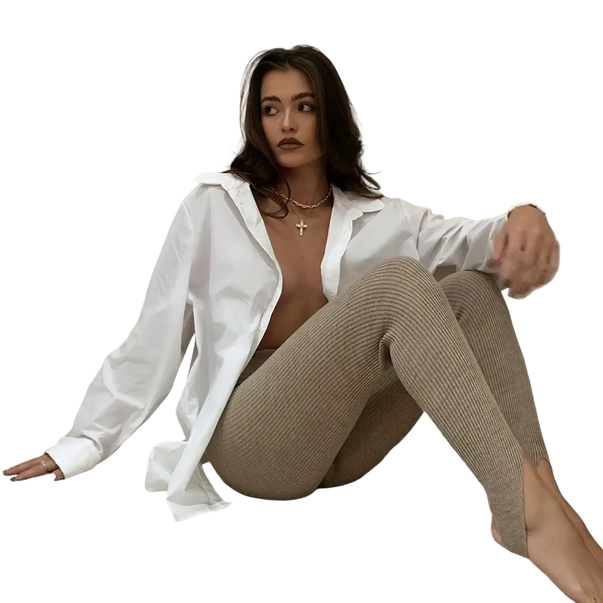 A woman wearing beige ribbed knit high waist leggings paired with a white button-up shirt