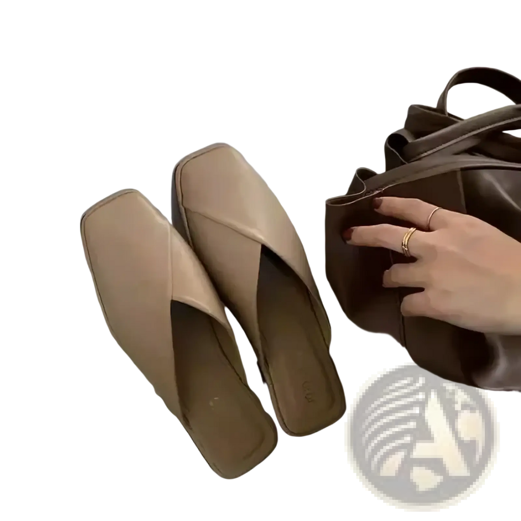 Beige square toe flat mules with a sleek minimalist design and soft leather finish