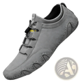 Beige suede leather men’s low top leisure shoe with gray suede upper and black laces featuring a sleek minimalist design