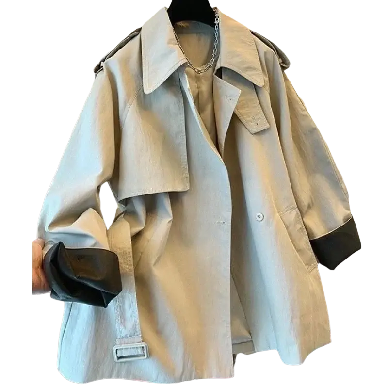 Beige trench coat with black leather trim on cuffs and collar featuring classic double-breasted design for autumn winter