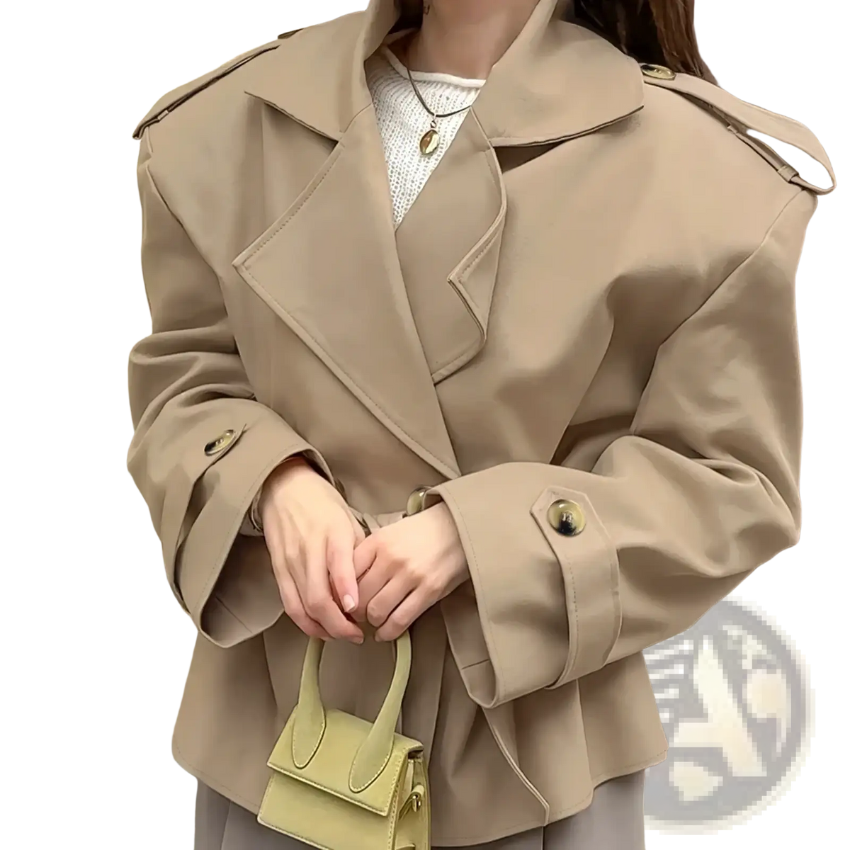 Beige trench coat with belted waist, structured shoulders, and gold toned buttons in a classic design