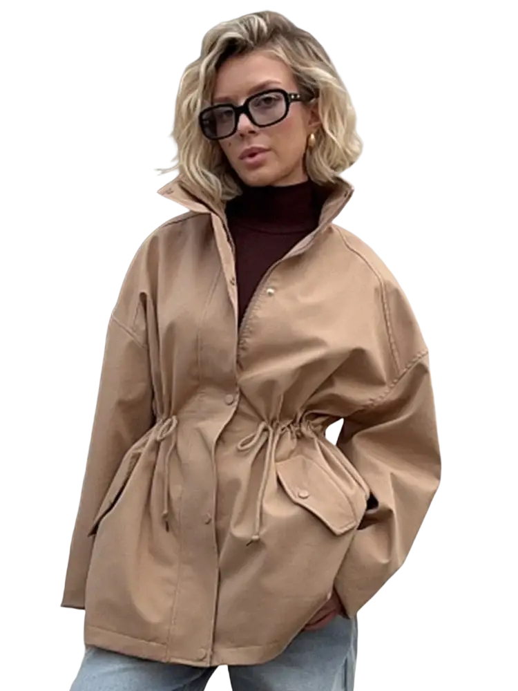 Beige utility trench coat with drawstring waist and flap pockets ideal for versatile outerwear layering