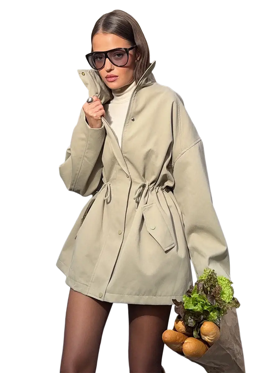 Beige utility trench coat with belted waist and front pockets designed for practical stylish outerwear use