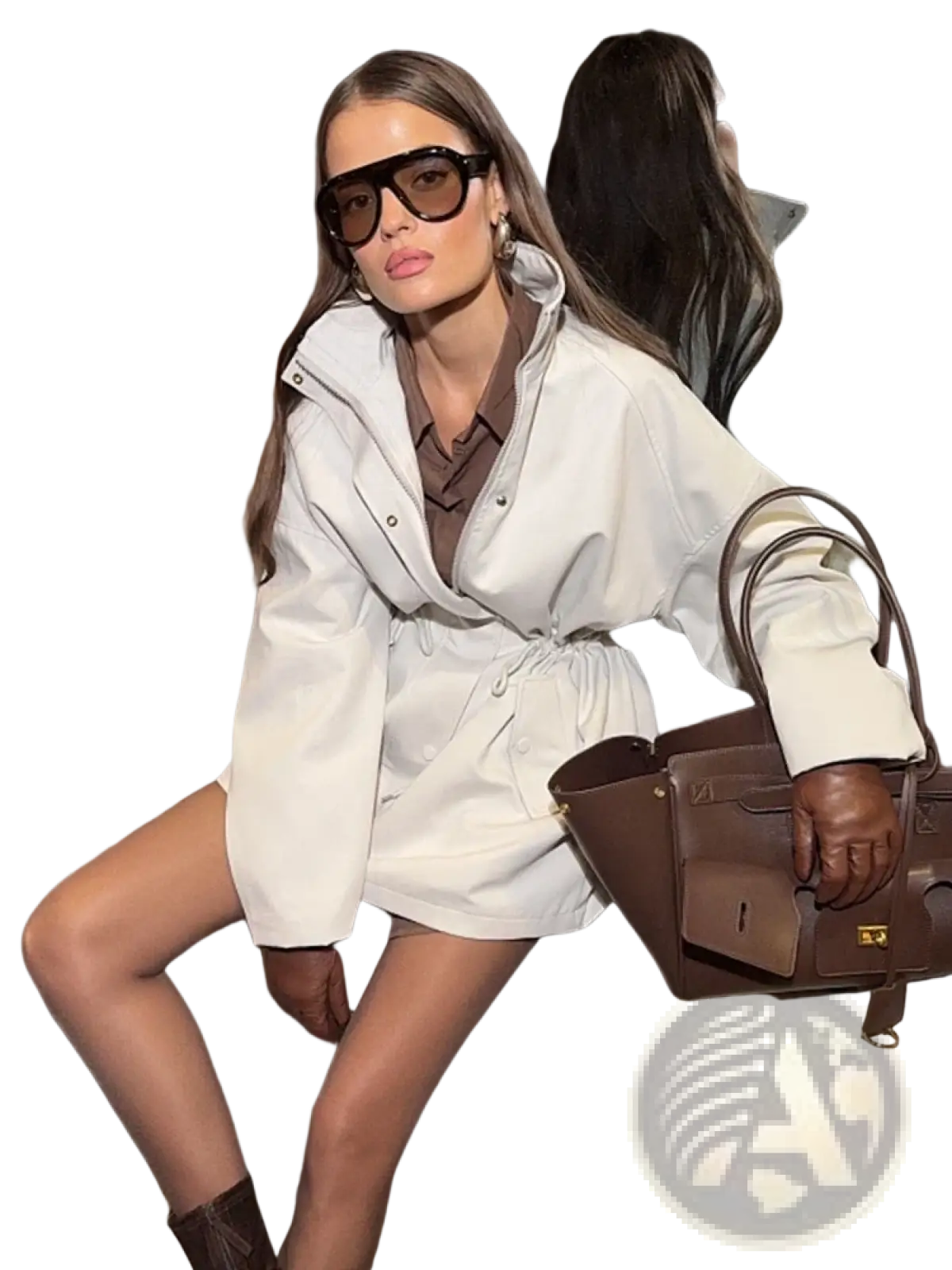 Brown leather handbag with gold hardware paired with beige utility trench coat featuring drawstring waist