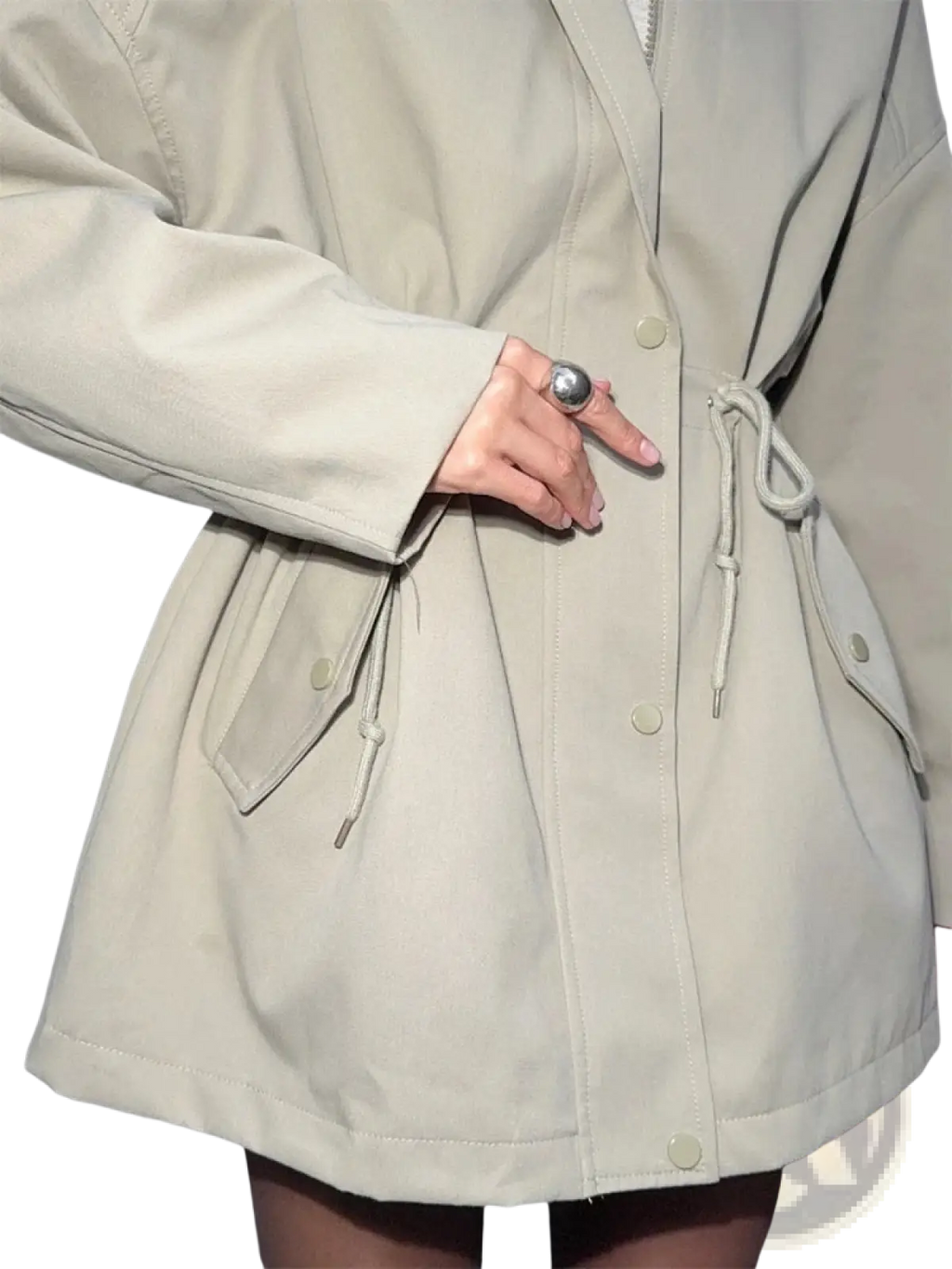 Beige utility trench coat with drawstring waist and front pockets designed for versatile outerwear use