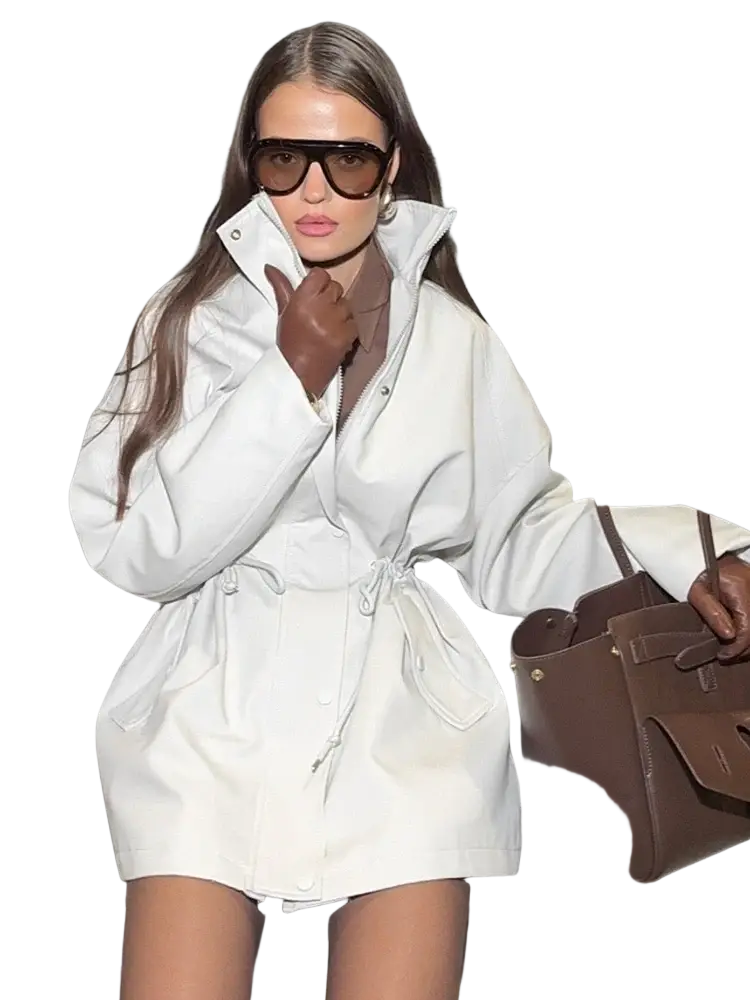 White leather trench coat with belted waist and large pockets in a beige utility trench coat style