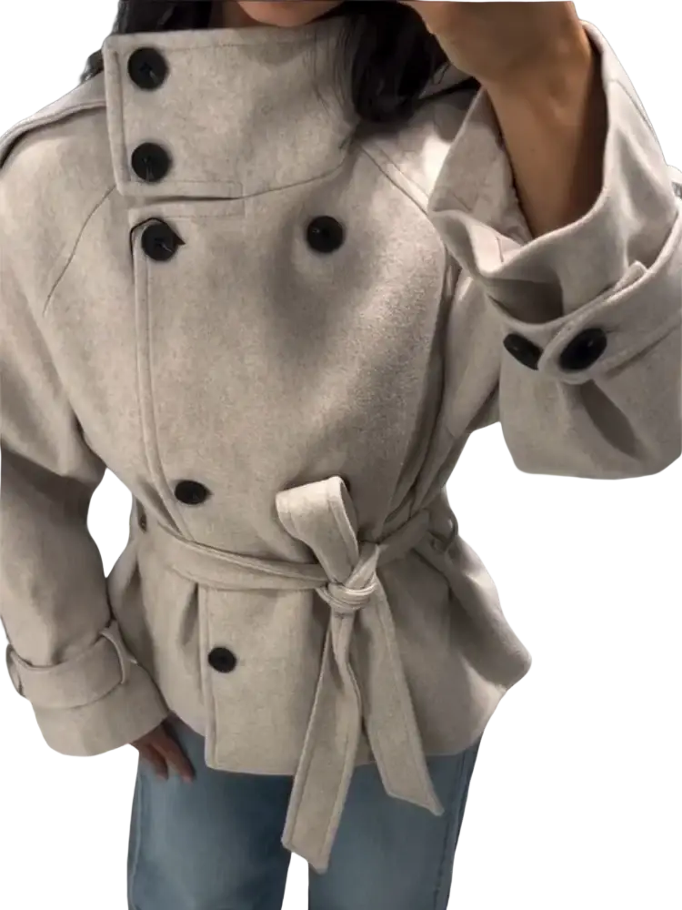 Beige wool belted short trench coat for women with black buttons and matched belt tied at the waist