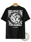 Back of black cotton men’s t-shirt with bold white believe in yourself universe graphic and swirling planet illustration