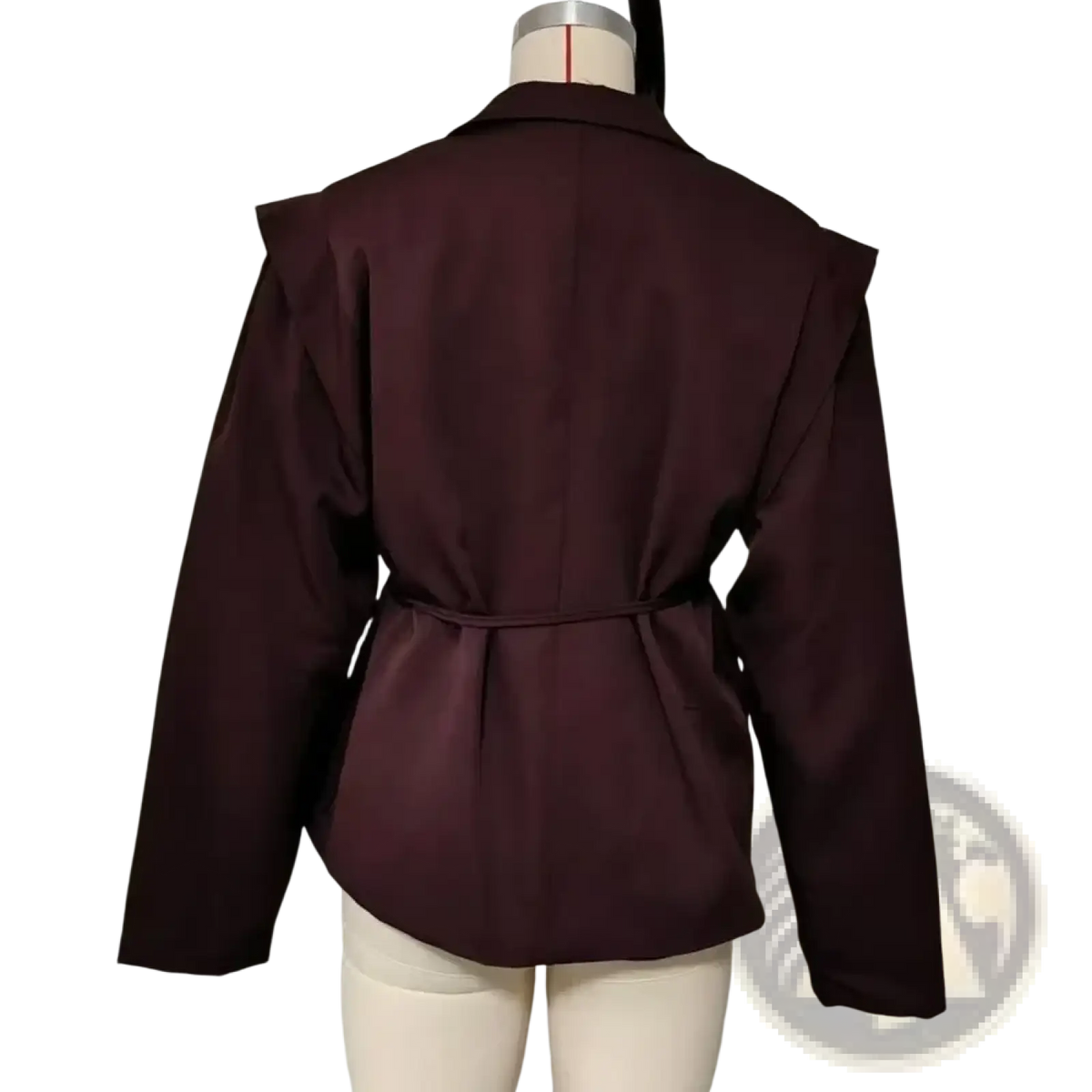 A dark burgundy belted satin blazer jacket with cinched waist and ruffled shoulders displayed on a mannequin