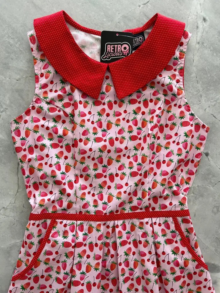 Pink sleeveless cotton berry cherry retro polka dot dress with red collar and matching belt featuring pockets