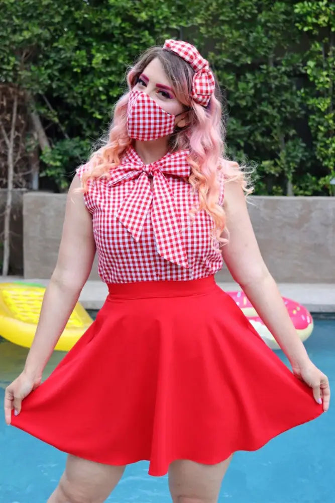 Red flared skirt with fitted waistband paired with berry good strawberry and red gingham reversible face mask