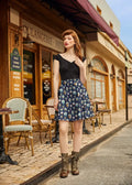 A navy blue best in show dog print pleated skater skirt with white and light blue skull motifs