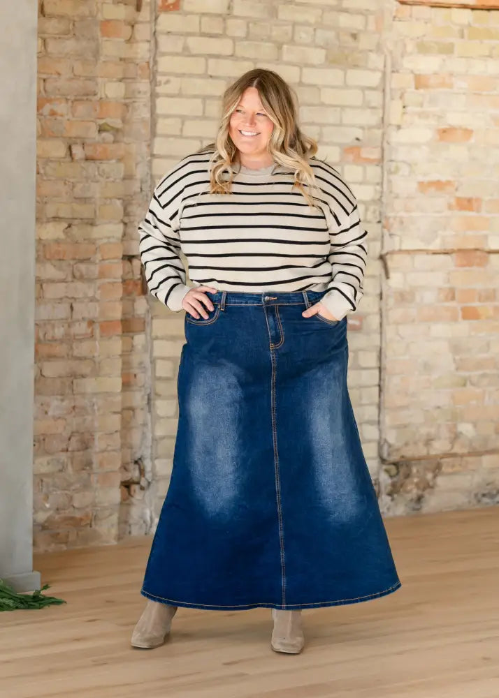 Bethany dark wash a-line denim maxi skirt in navy blue with a straight cut and visible stitching along seams