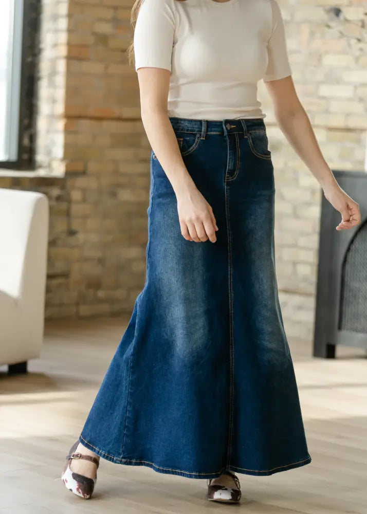 Bethany dark wash a-line denim maxi skirt in classic dark blue with visible stitching and flared silhouette