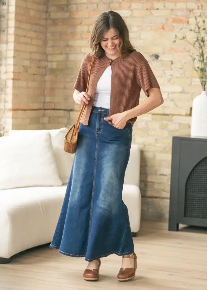 Brown ribbed knit cardigan with short sleeves and button closure paired with bethany dark wash a-line denim maxi skirt