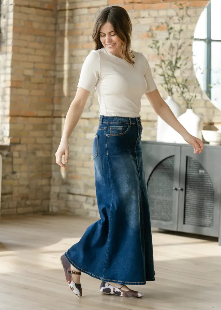 Bethany dark wash a-line denim maxi skirt featuring a flowing dark blue high waist five-pocket design