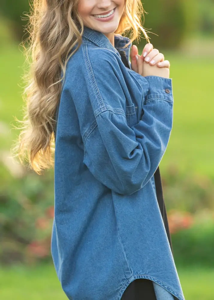 Betty Denim relaxed button up shirt in soft medium-wash blue denim with a relaxed fit and buttoned cuffs