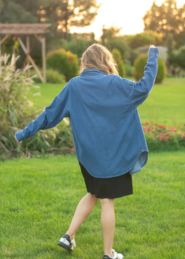 Blue denim shirt with long sleeves and relaxed fit from Betty Denim featuring a button-up front closure