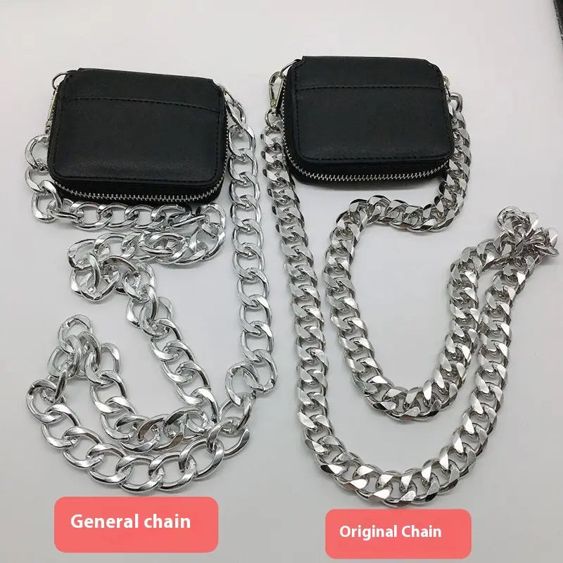 Black leather mini waist bag with chunky silver-toned chain strap featuring coin purse style compartments.