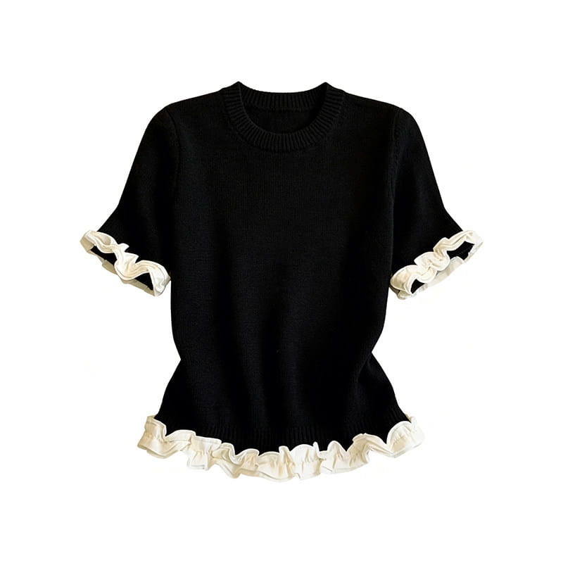 Black knit short sleeve top with ruffled cream trim at cuffs and hem in a colorblock ruffled short sleeve knit top design.