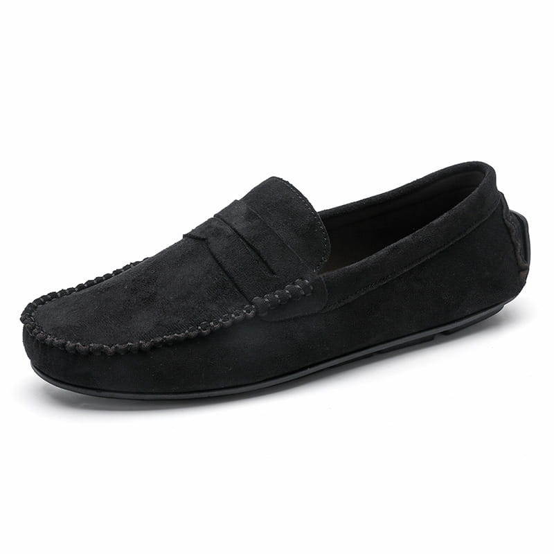 Mocassins en daim noirs au design classique de mocassin et à des finitions cousues à la main, dans un style de chaussure en velours confectionnée à la main