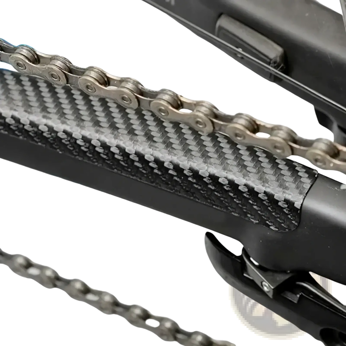 Bike chain protector pvc frame guard black on carbon fiber chainstay with textured weave and silver metallic bike chain